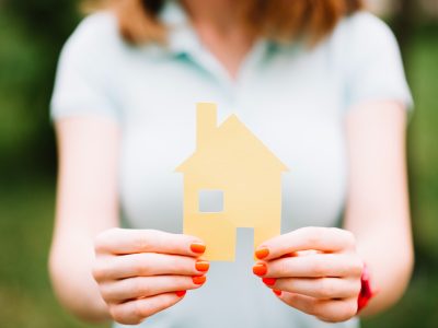 anonymous-model-posing-with-paper-house.jpg